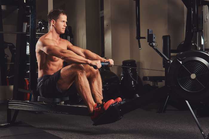 Rowing machine working out the muscles with a rowing machine
