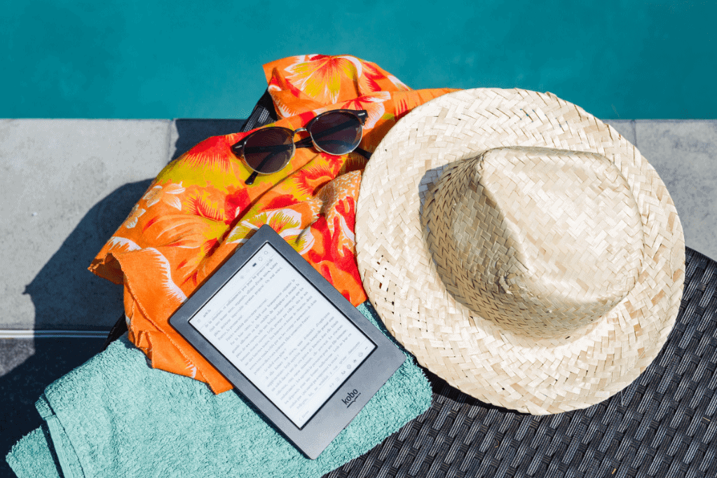 Black Amazon Kindle Tablet Near Brown Drawstring Sun Hat