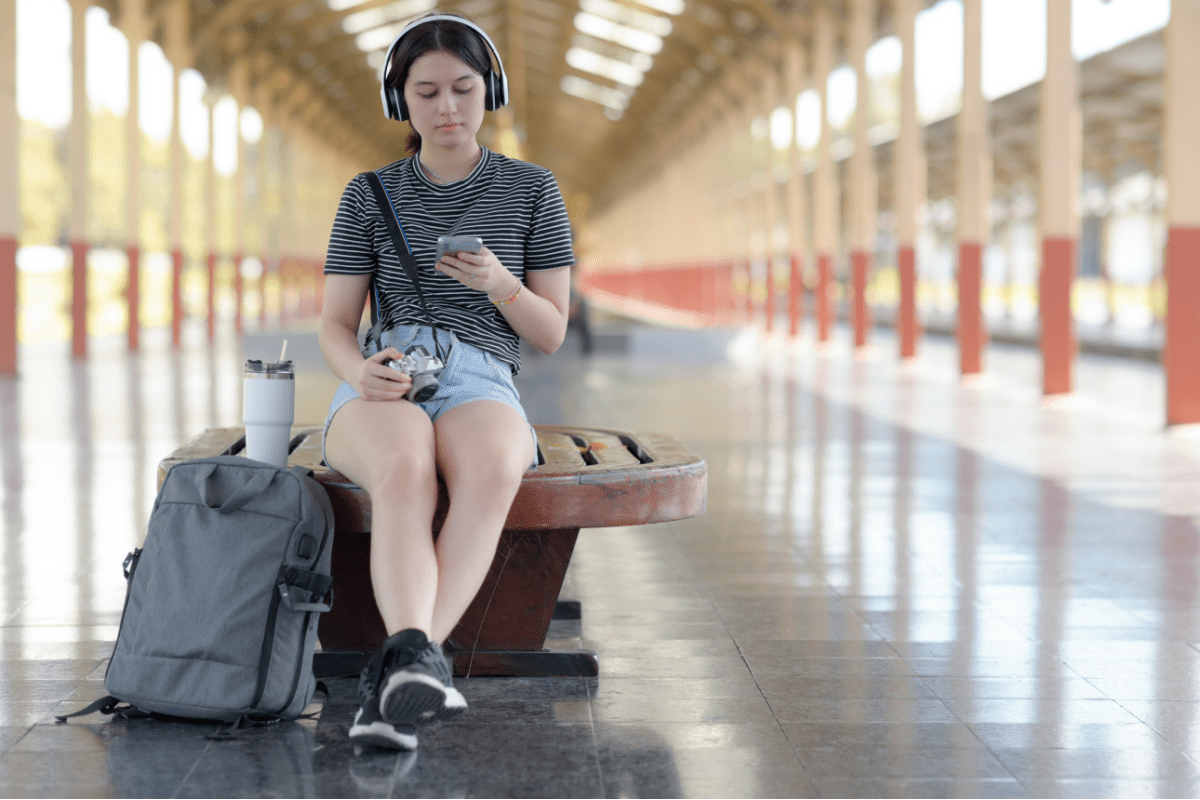 Female Traveller With Headphones