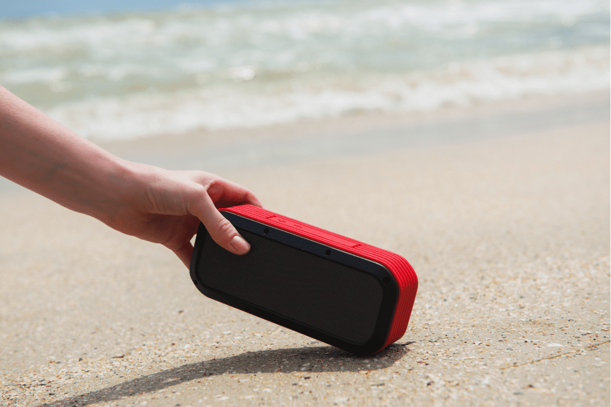 Woman takes Bluetooth Portable Speaker