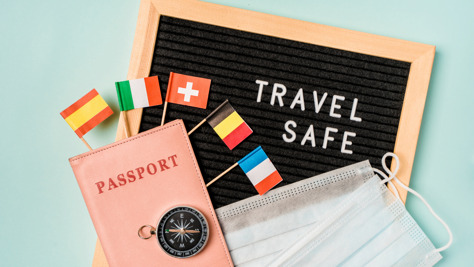 Travel safely concept. Essential travel accessories passports, medical masks.