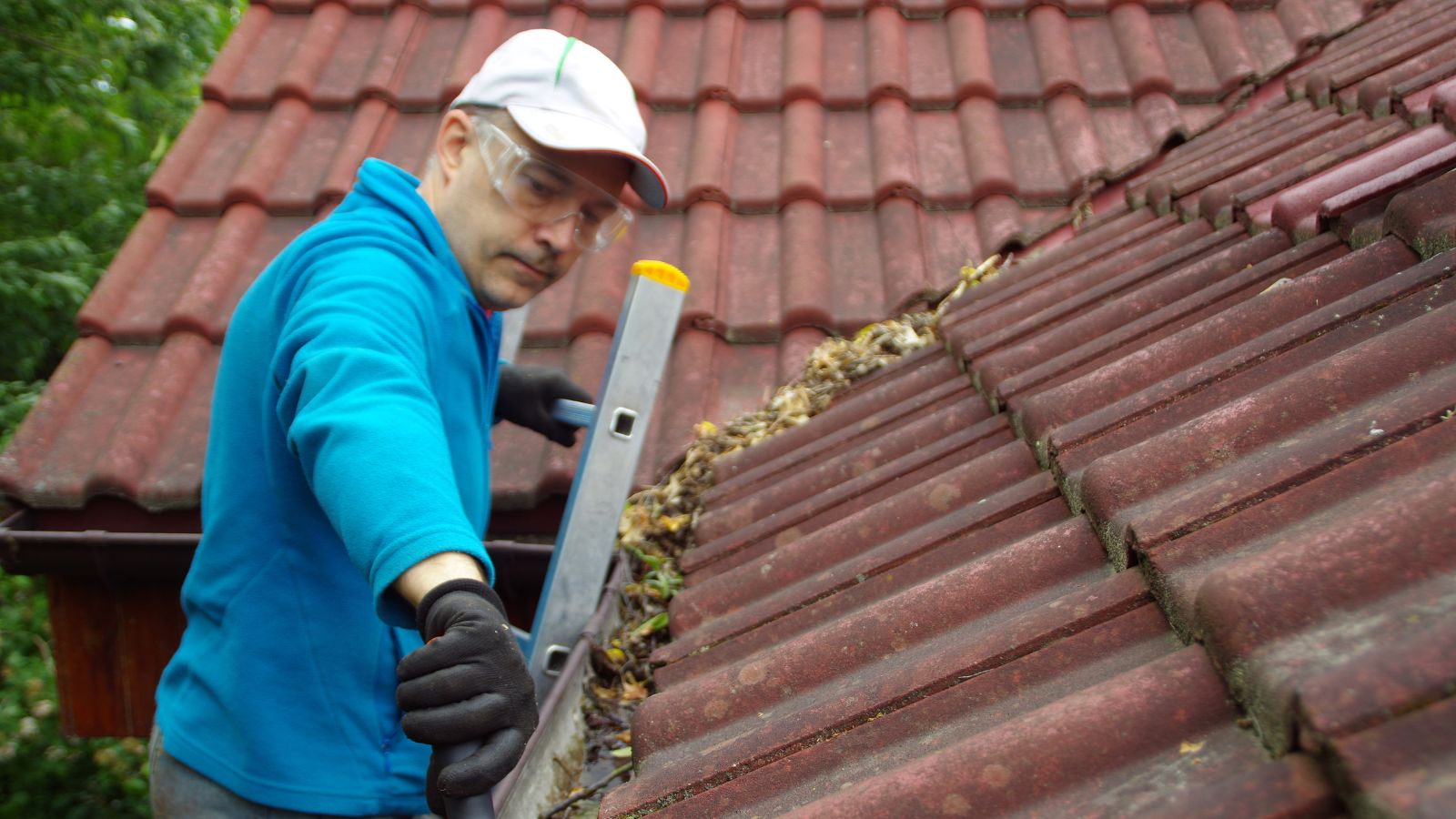 Man Cleaning Roof