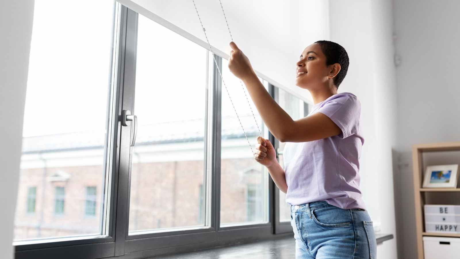 Woman Closing Curtains