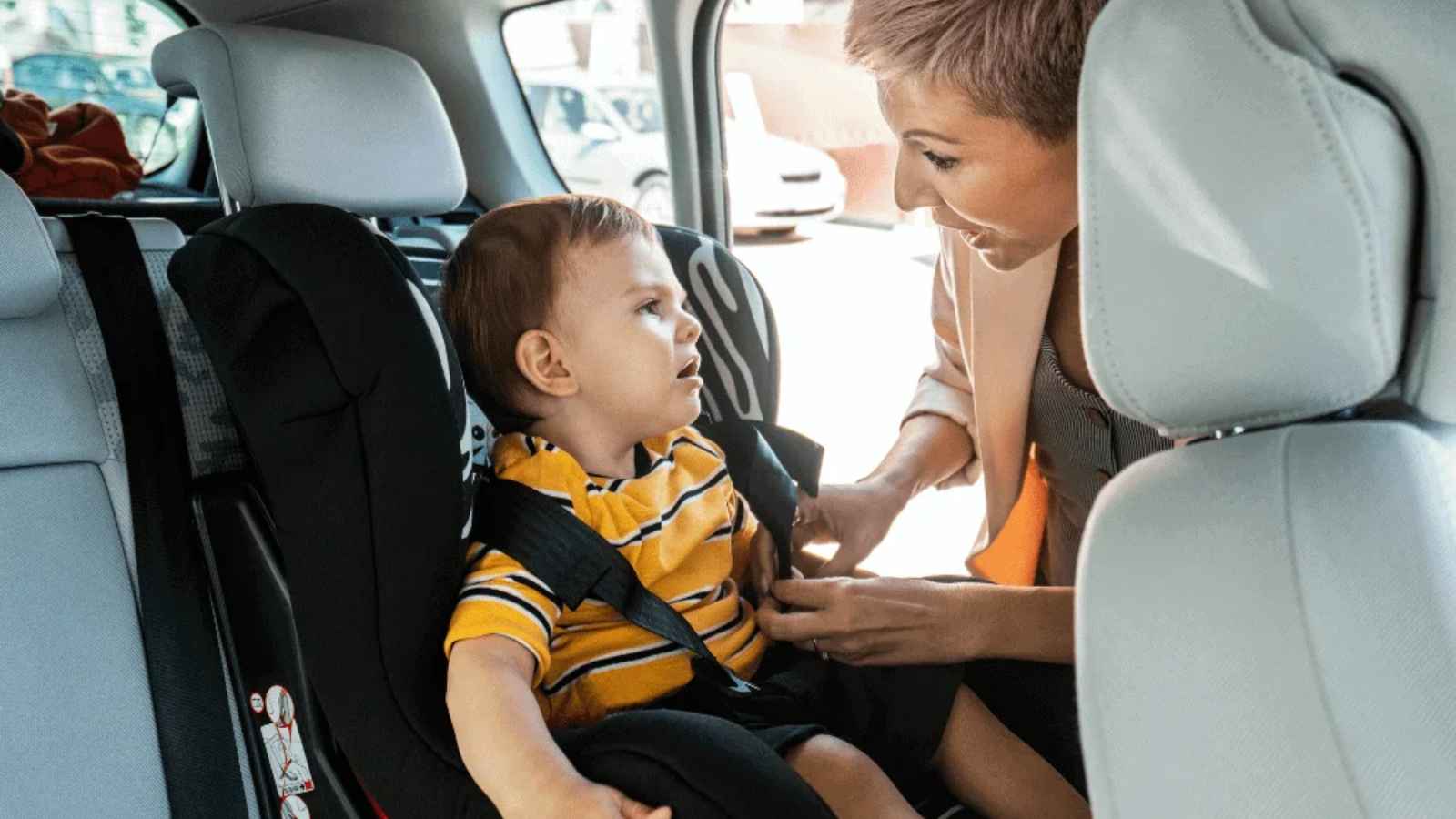 baby strapped in a car seat