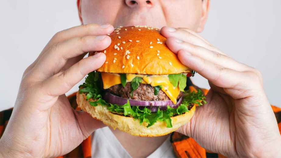 person eating a burger
