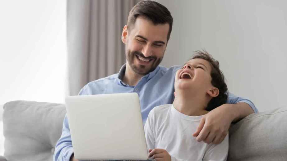 dad and son laughing