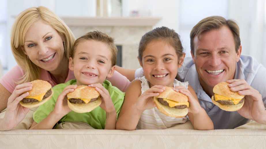 a family eating burgers