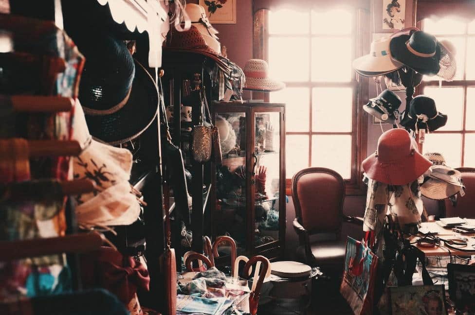A messy room full of clothes