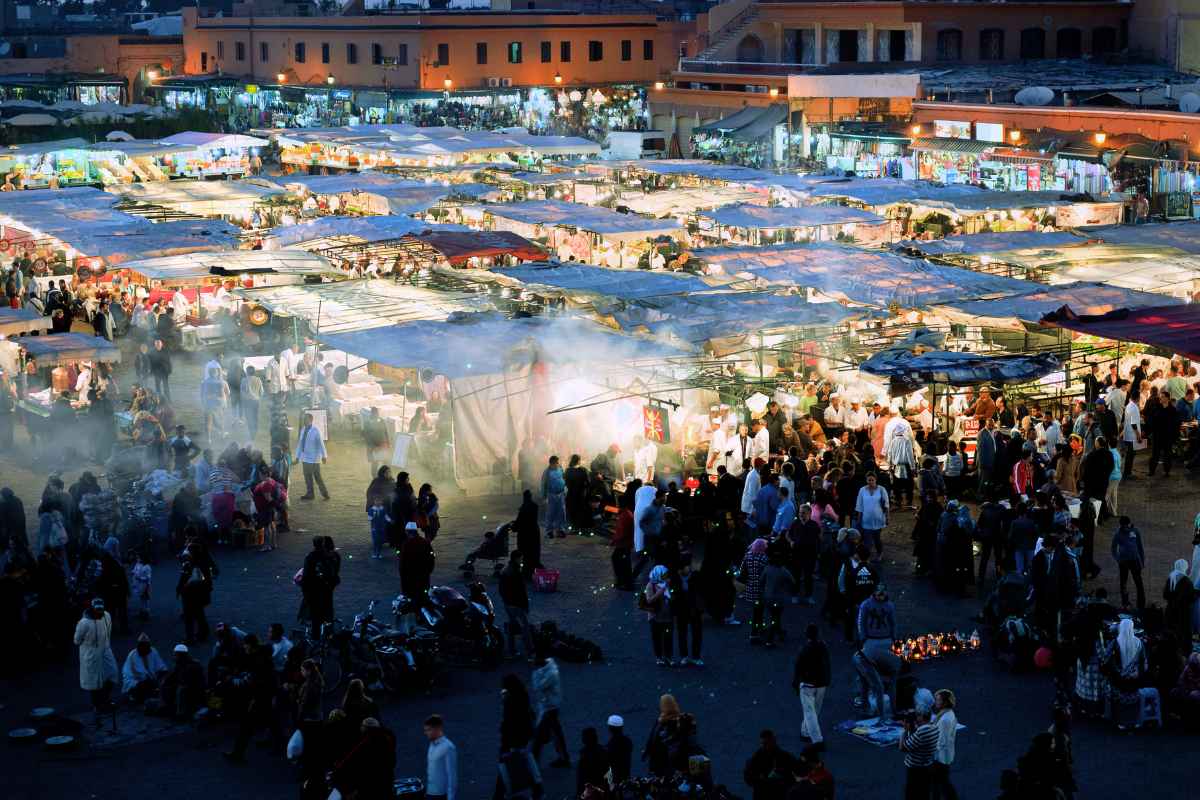 Djemaa El Fna Square in Marrakech is a UNESCO World Heritage Site and a must-visit spot for an unforgettable experience. This vibrant marketplace comes alive at night and offers a sensory overload of traditional Moroccan culture with storytellers, acrobats, musicians, snake charmers, and tantalizing Moroccan cuisine. Don't forget to shop for traditional handicrafts in the surrounding souks.