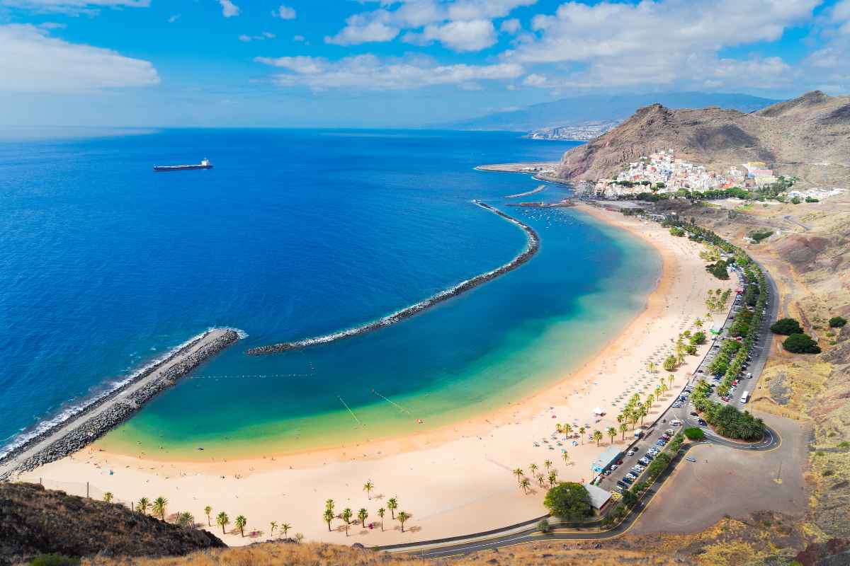 Playa de Las Teresitas in Tenerife is a beautiful beach surrounded by the Anaga Mountains. Its golden sands imported from the Sahara desert make a striking contrast against the Atlantic waters. The beach offers modern amenities and recreational activities. It's a perfect spot for relaxation, water sports, and savoring local cuisine. Playa de Las Teresitas promises a memorable holiday experience.