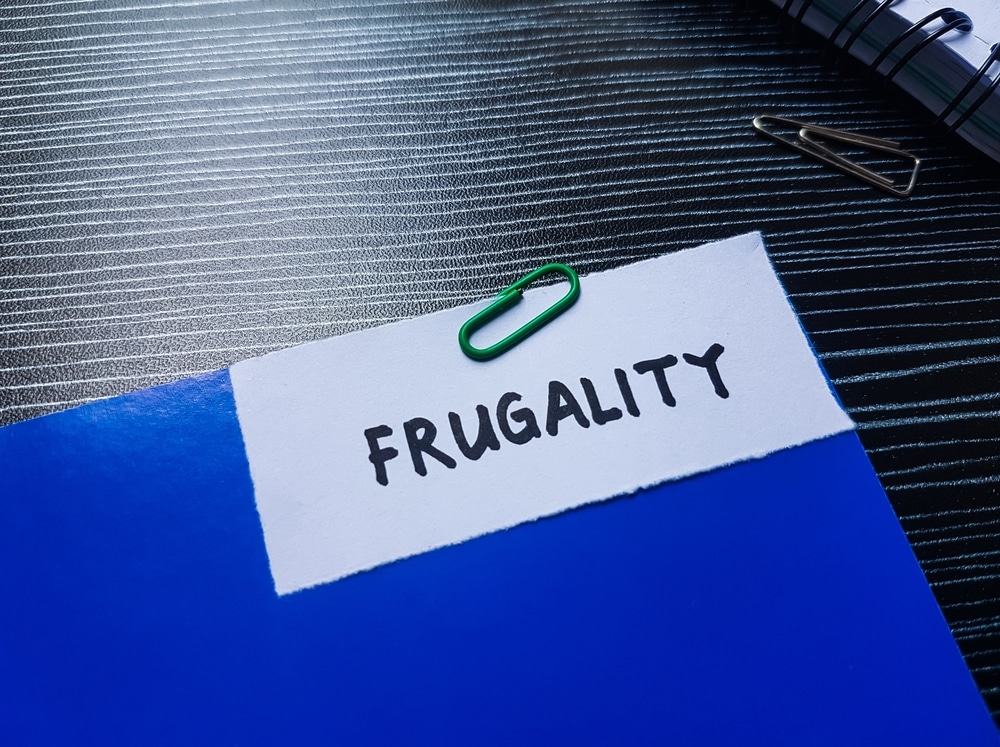 Frugality writting on table background